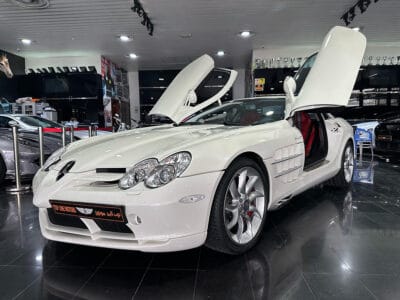 Mercedes-Benz SLR 2005 a high-performance grand tourer, a collaboration between Mercedes-Benz and McLaren, featuring a 5.4-liter supercharged V8 engine producing around 617 horsepower