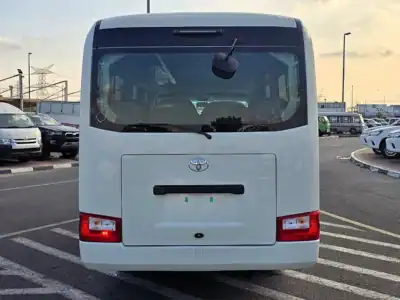 2026 Toyota Coaster VIP 4.2l diesel MT 22 Seats Electric Door White Brown