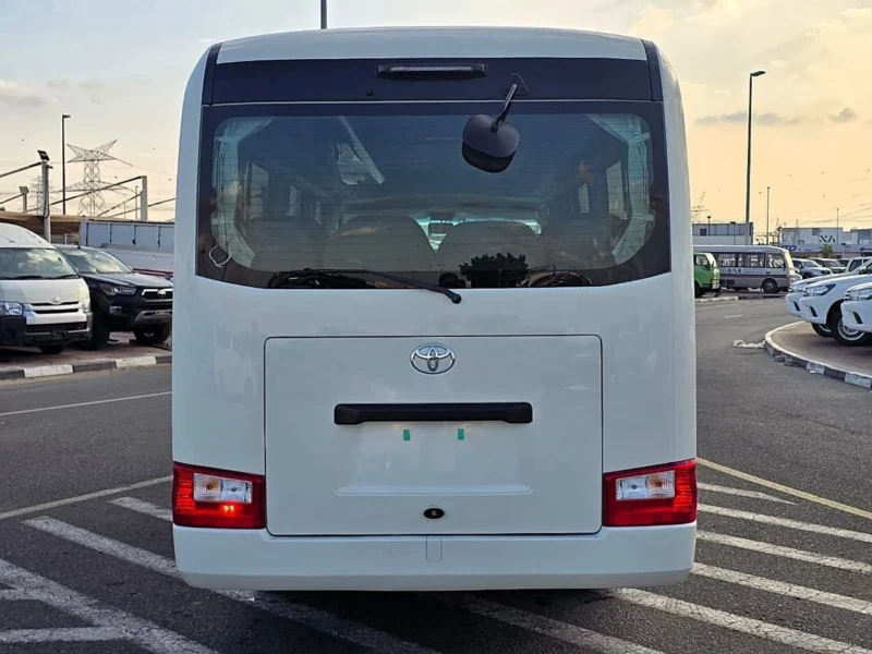 2026 Toyota Coaster VIP 4.2l diesel MT 22 Seats Electric Door White Brown