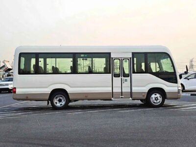 2025 Toyota Coaster 2.7L PETROL MT DUAL TONE 4 Cylinders Engine White Brown Bus