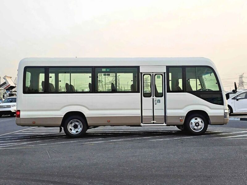 2025 Toyota Coaster 2.7L PETROL MT DUAL TONE 4 Cylinders Engine White Brown Bus
