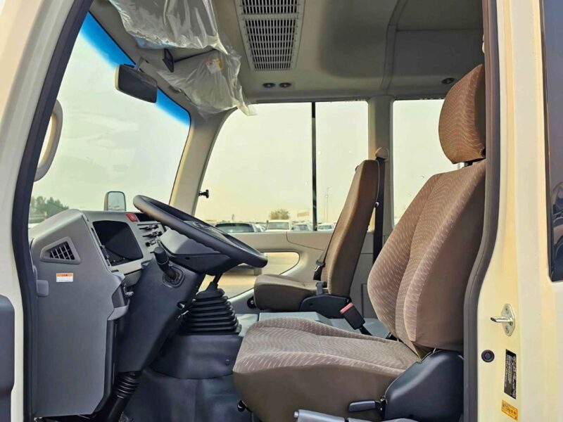 2025 Toyota Coaster 2.7L PETROL MT DUAL TONE 4 Cylinders Engine White Brown Bus