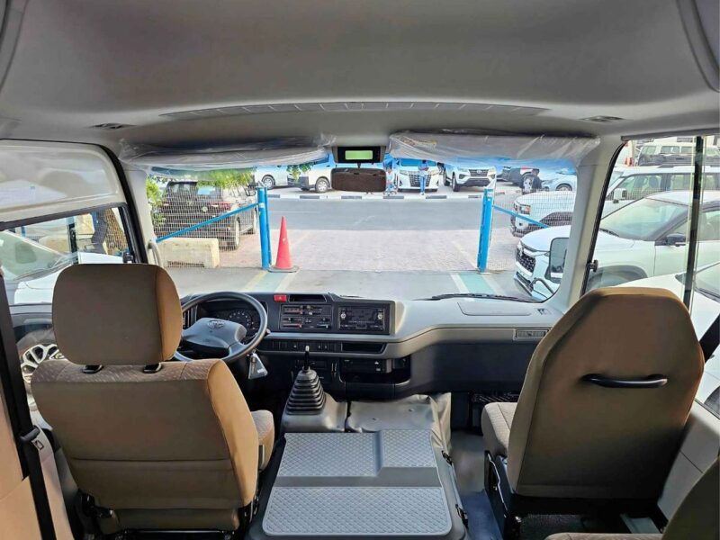 2025 Toyota Coaster 2.7L PETROL MT DUAL TONE 4 Cylinders Engine White Brown Bus