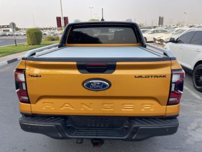 The 2023 Ford Ranger Wildtrak 2.0L Bi-turbo Diesel 4 Cylinders Yellow Black Pick Up Truck