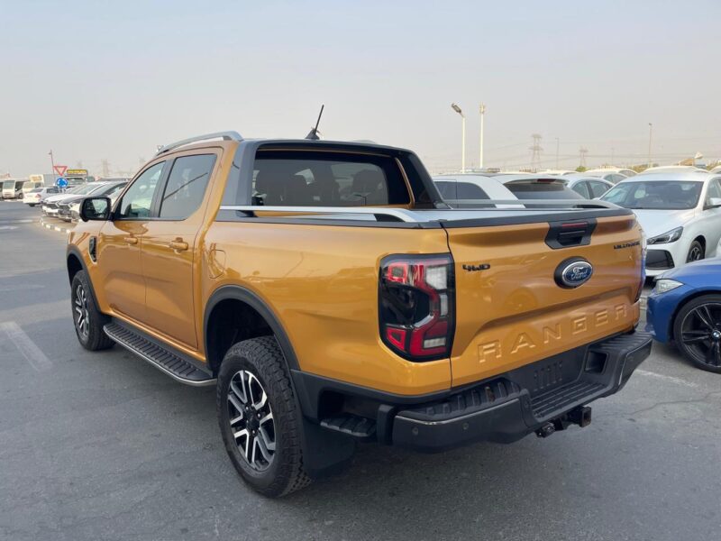 The 2023 Ford Ranger Wildtrak 2.0L Bi-turbo Diesel 4 Cylinders Yellow Black Pick Up Truck
