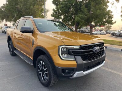 The 2023 Ford Ranger Wildtrak 2.0L Bi-turbo Diesel 4 Cylinders Yellow Black Pick Up Truck