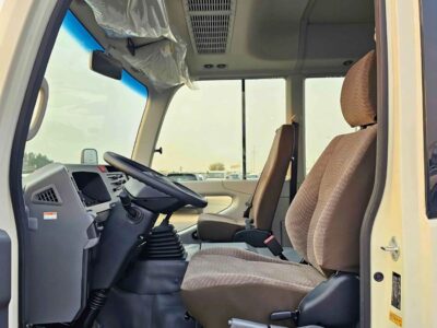 2025 Toyota Coaster 2.7L PETROL MT DUAL TONE 4 Cylinders Engine White Brown Bus