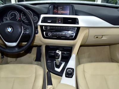 2016 BMW 3-Series 318i 1.5-liter Turbocharged 3-cylinder Engine White Beige Sedan GCC