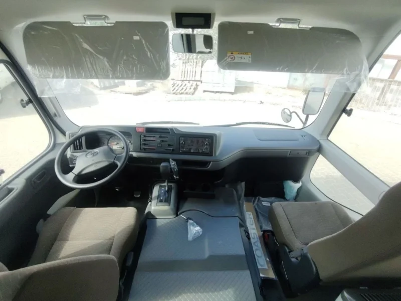 2026 TOYOTA COASTER HIROOF 2.8L DIESEL A/T 22 SEATER LUGGAGE RACK White Grey Bus